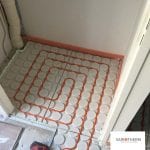 Variotherm lage opbouw vloerverwarming in toiler en hal
